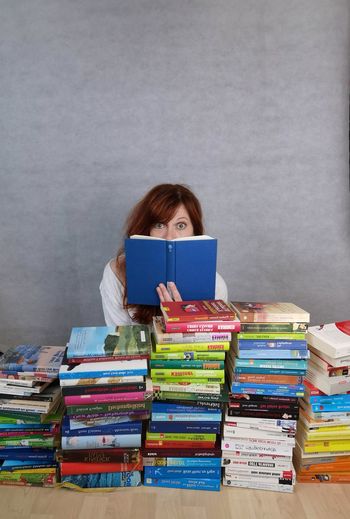 Full frame shot of woman with books on table