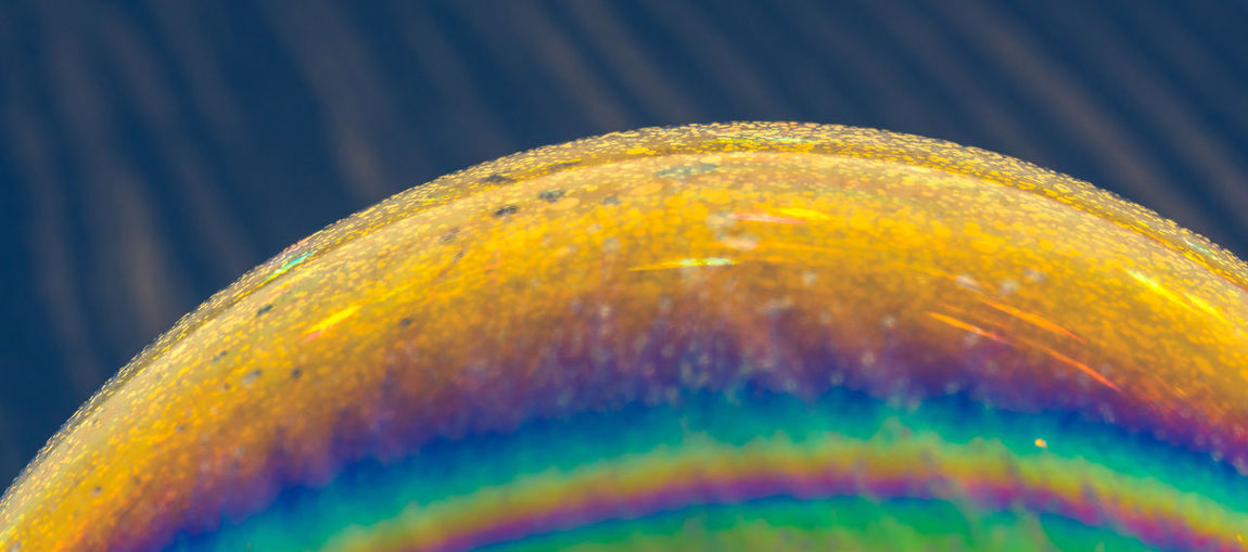 Macro shot of bubbles in rainbow