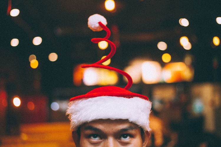 Close-up of man wearing hat