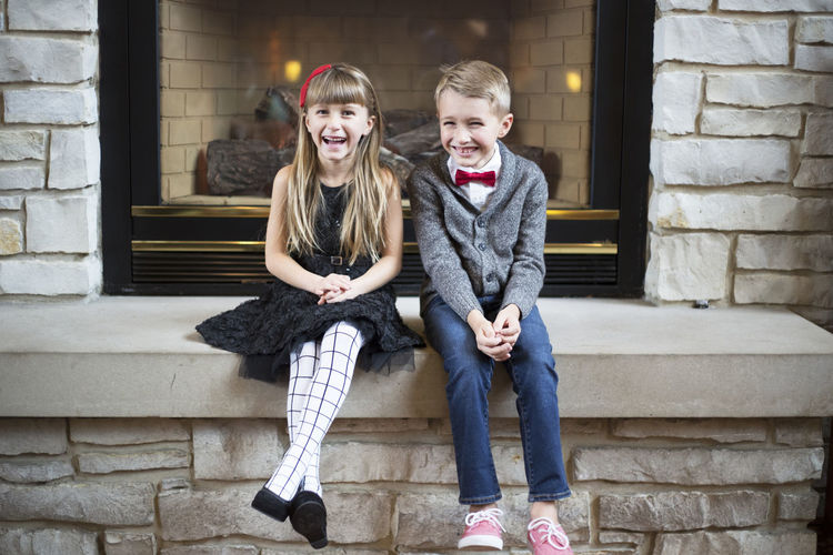 Portrait of smiling girl sitting outdoors