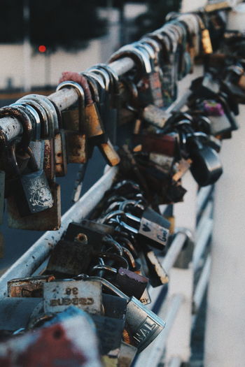 Close-up of padlocks on railing