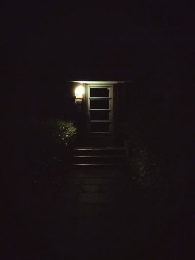 View of walkway at night