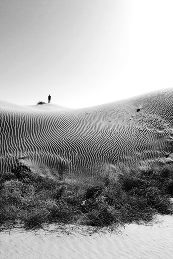 Scenic view of desert against clear sky