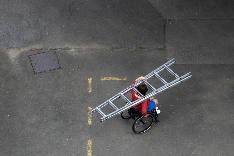 High angle view of shopping cart on street