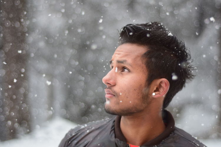 Portrait of man in snow