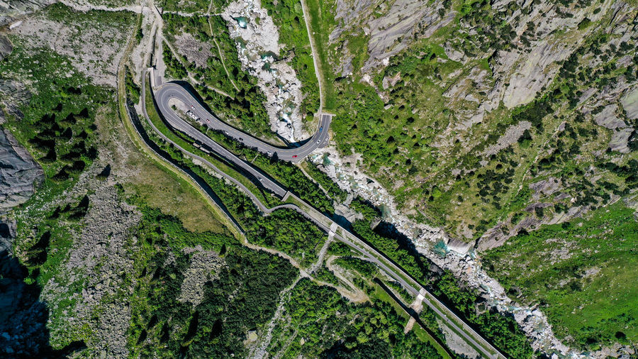 High angle view of winding road amidst trees