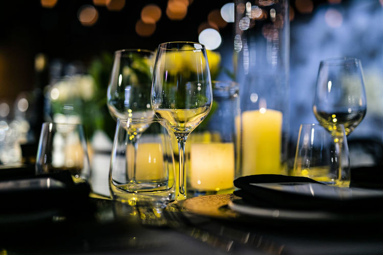 Close-up of wine glasses on table in restaurant