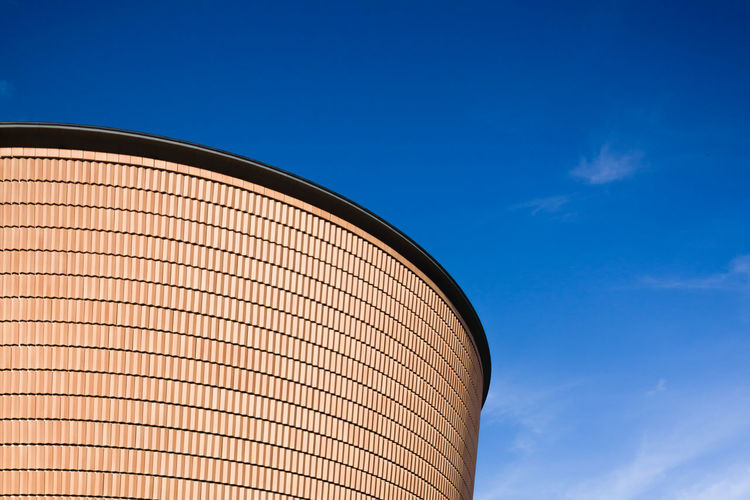 Low angle view of building against blue sky