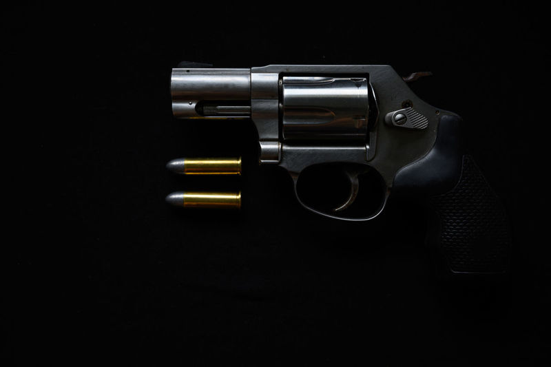 Close-up of camera over black background