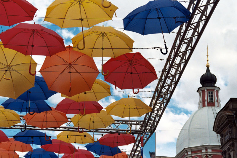 Low angle view of umbrellas against sky
