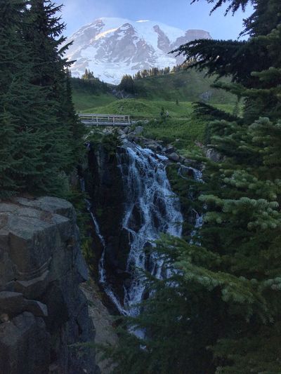 Scenic view of waterfall against mountain 