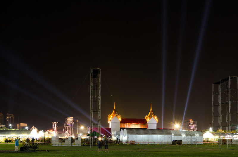 Illuminated grand palace against sky at night