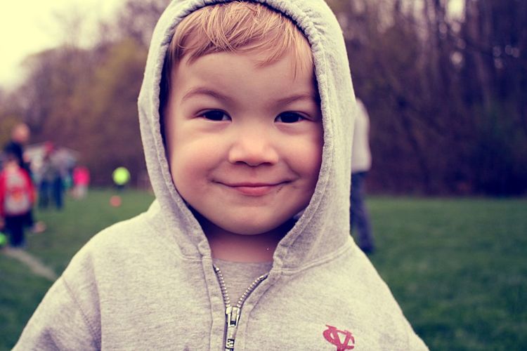 Close-up portrait of smiling cute boy