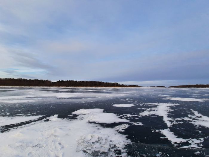 Scenic view of sea against sky during winter