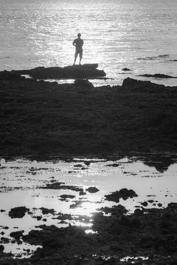 Silhouette man on beach