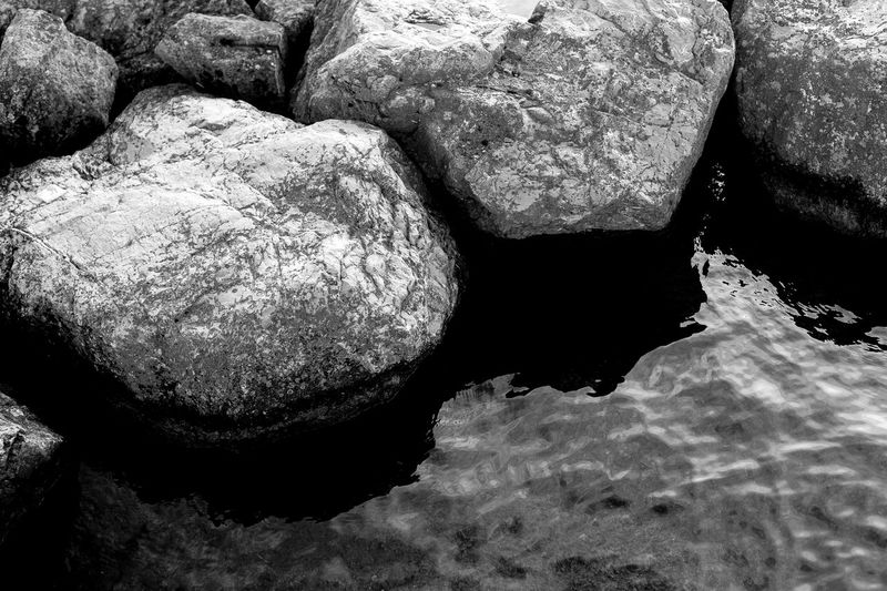 Full frame shot of rocks at shore