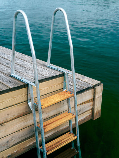 Tranquil scene of wooden jetty with a ladder