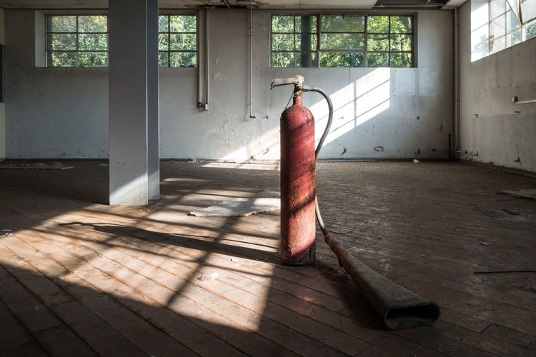 Industrial fire extinguisher in an empty room