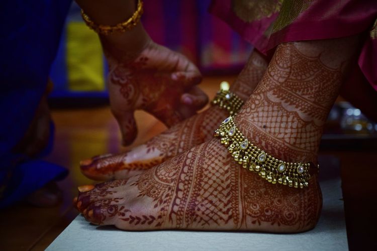 Mehndi applied to bride's legs