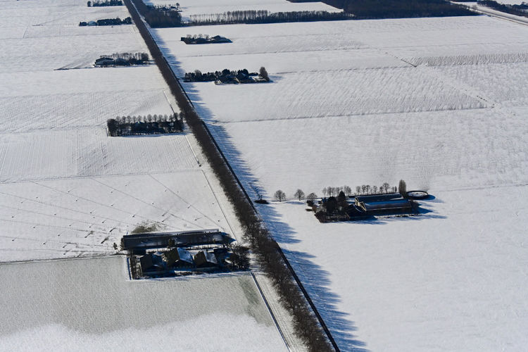 High angle view of cars on snow covered landscape