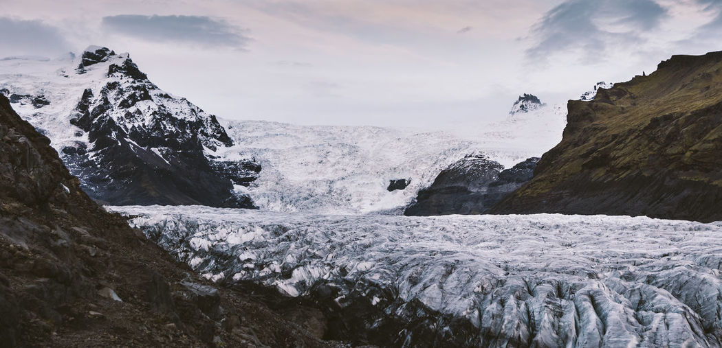 Scenic view of snowcapped mountains against sky