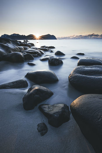 Rocks and water in vareid beach in lofoten