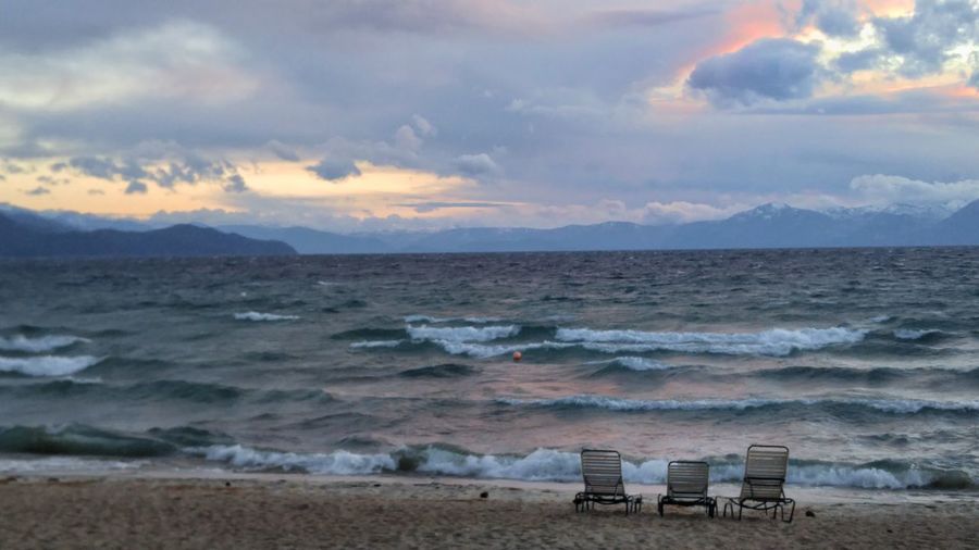 Scenic view of beach against sky during sunset