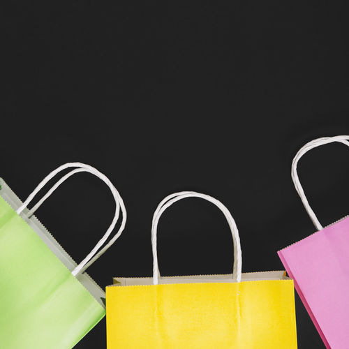 Close-up of bag against black background