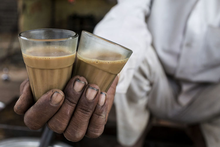 Close-up of hand holding chai tea