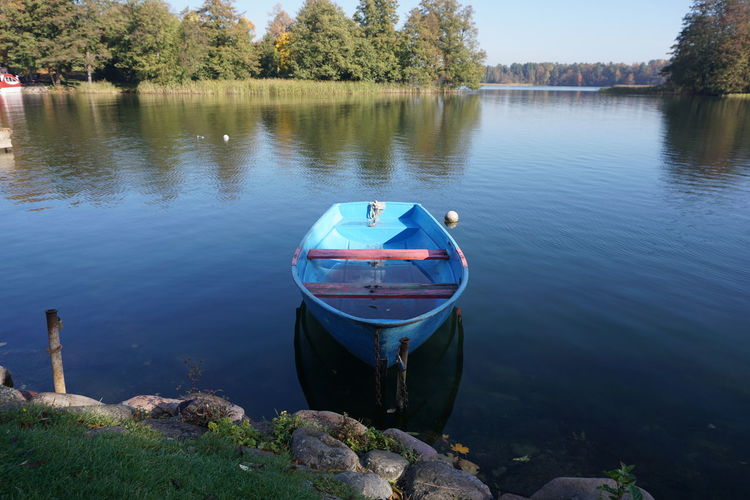 Boat moored in lake