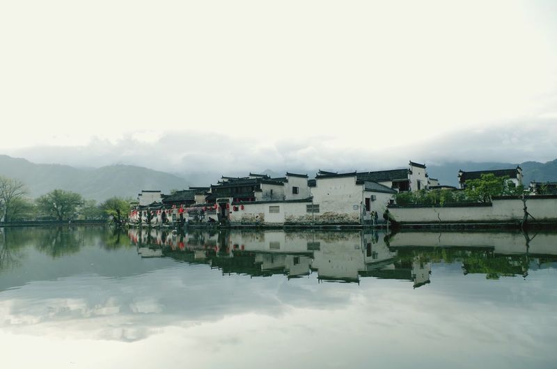 Reflection of houses in lake
