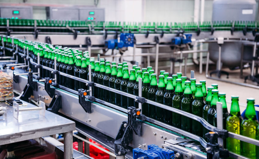 Close-up of bottles in factory