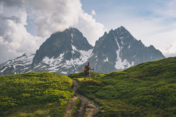 Young male hikes to aiguillette des posettes, french alps, chamonix.