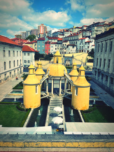 High angle view of yellow buildings against sky