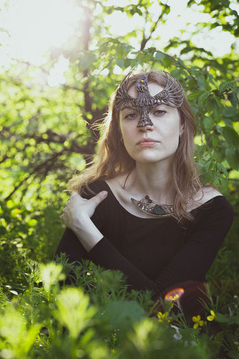 Close up woman with druid bird mask portrait picture
