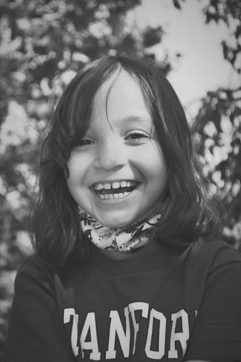 Portrait of smiling girl standing outdoors