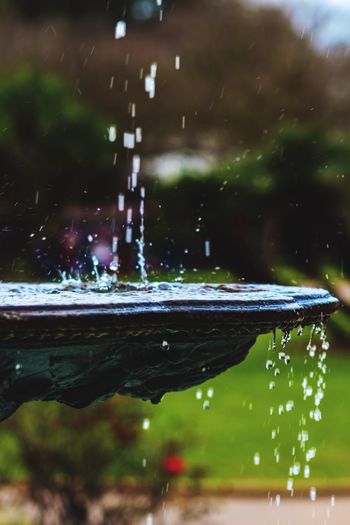 Water splashing in fountain at garden