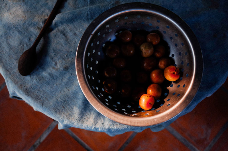 High angle view of fruits in container on table