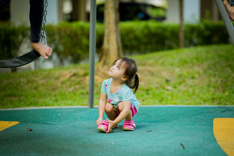 Full length of girl playing on outdoors