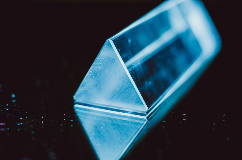 Close-up of prism against black background