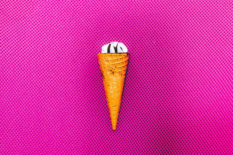 Close-up of ice cream on pink table