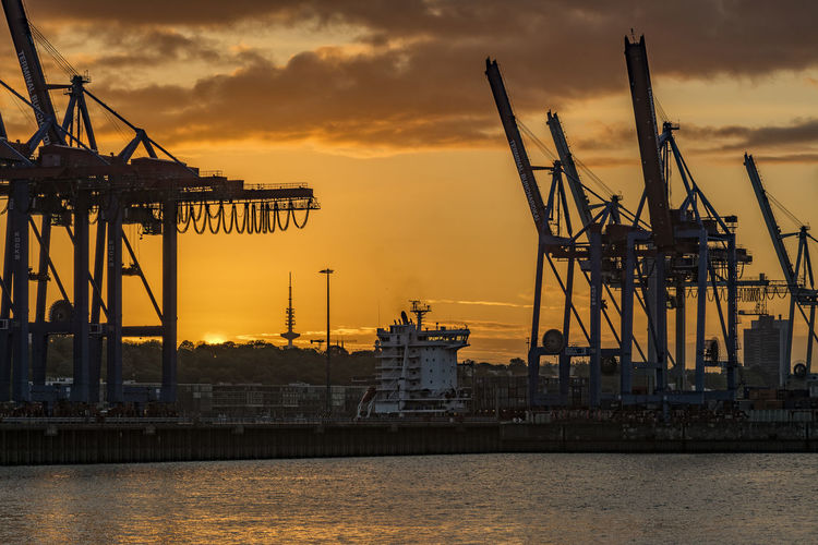 View of cranes at commercial dock