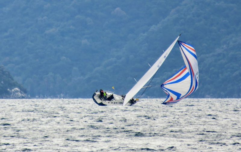 Boat sailing in sea against sky
