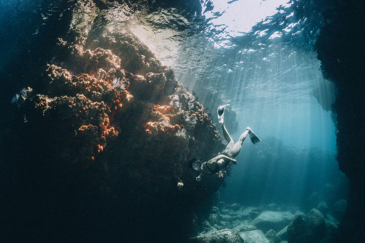 Full length of woman swimming underwater