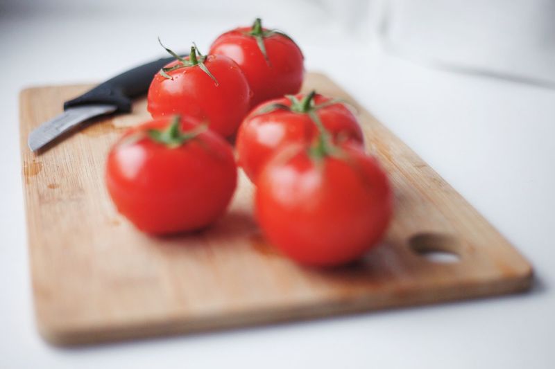 Close-up of tomatoes on cutting board
