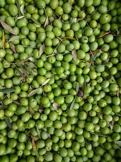 Full frame shot of green olives for sale at market