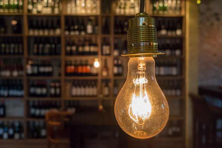 Close-up of illuminated light bulb in bar