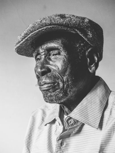 Portrait of man wearing hat 80plus years african
