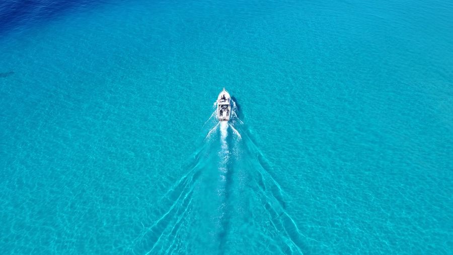 High angle view of boat sailing in sea