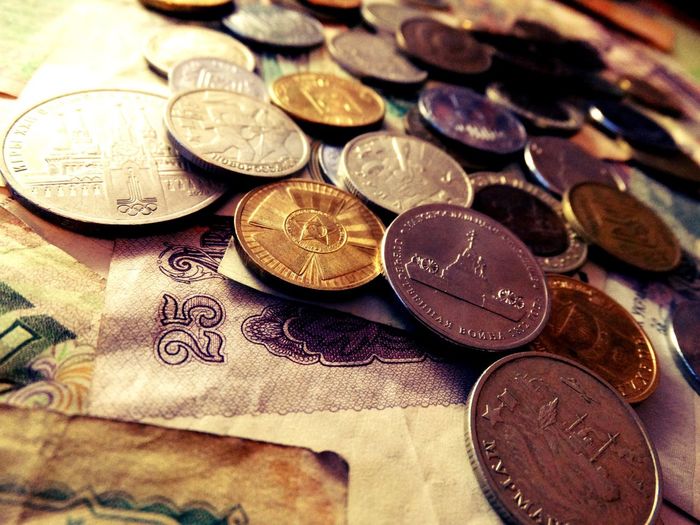 Close-up of currency on wooden tables
